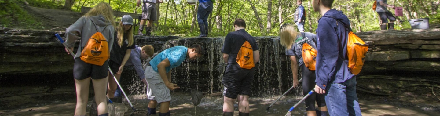 kids exploring at water falls