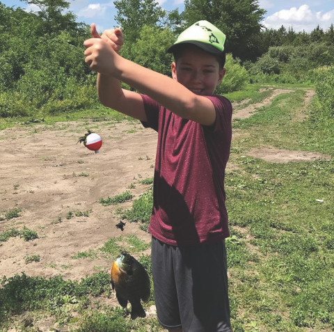 kid with fish