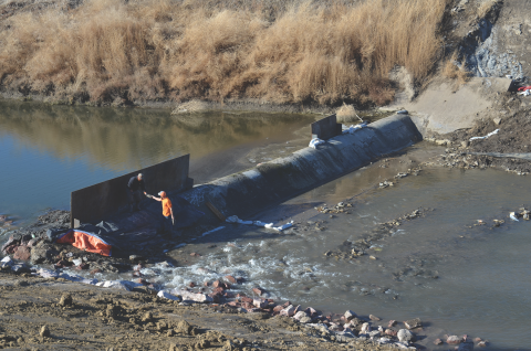 This Oak Creek weir, near 14th and Saunders streets, is being rehabilitated.